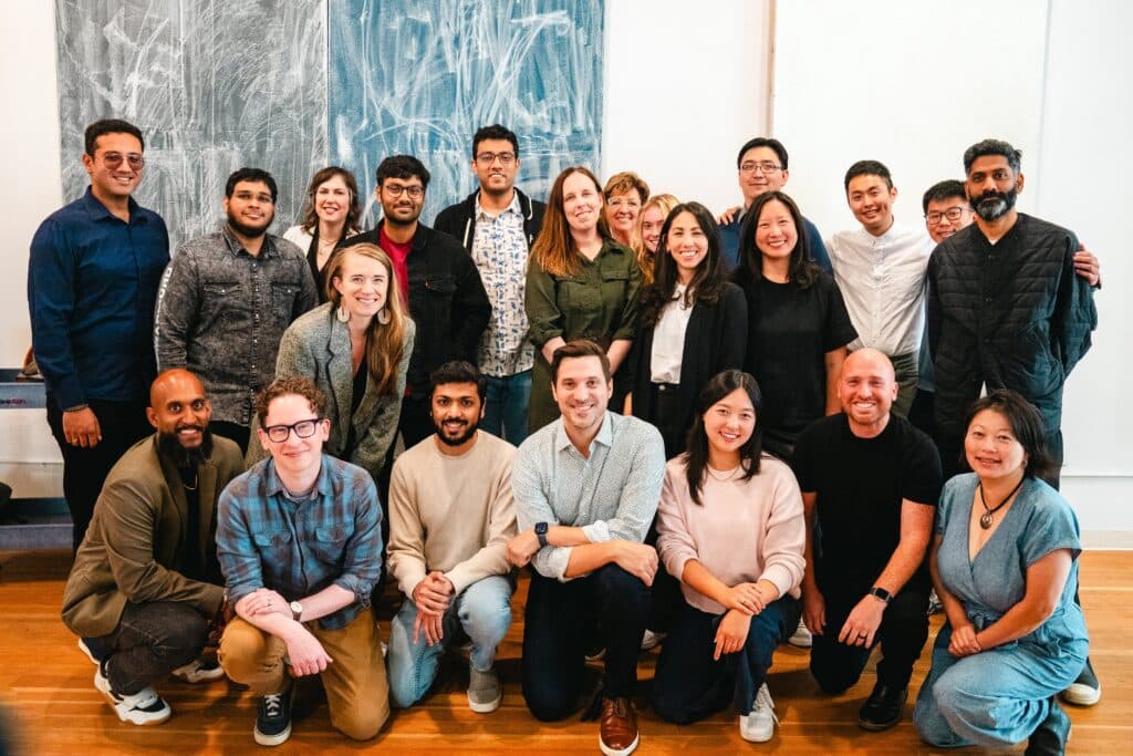 The Abridge AI team posing together in an office space