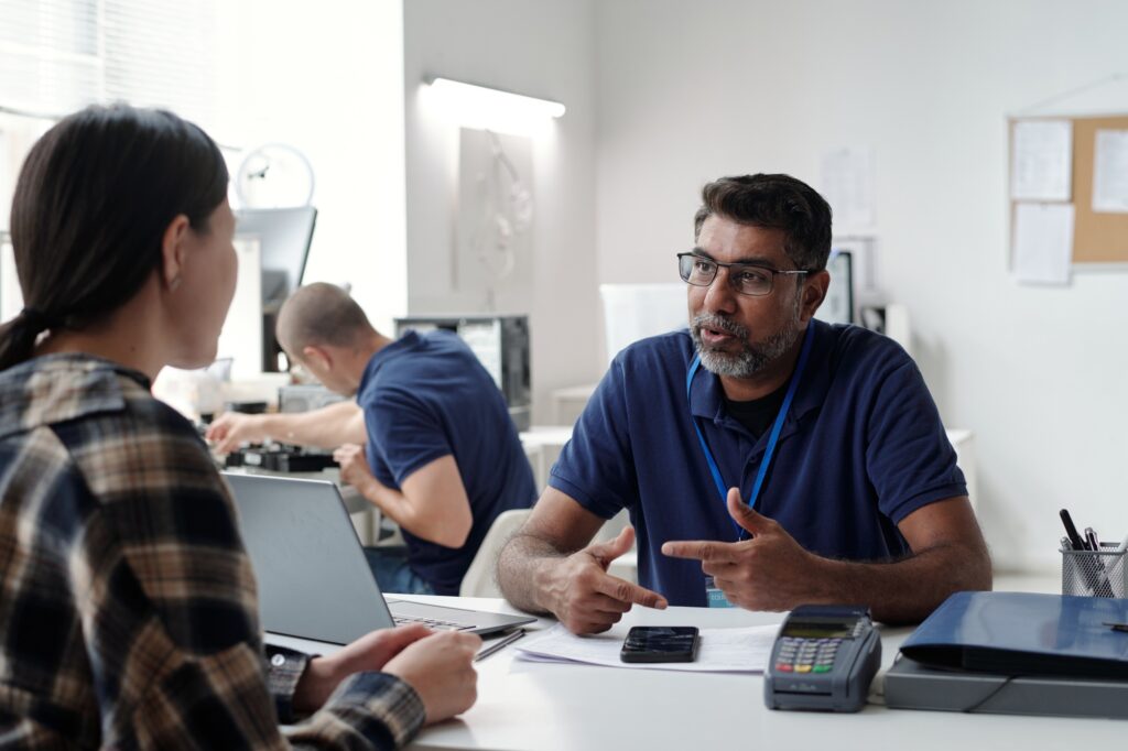 Discussing Financial Services at Office Meeting
